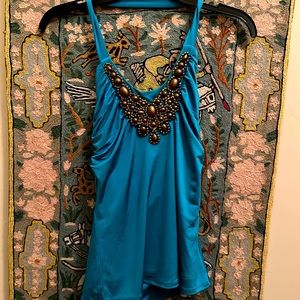 Teal halter top with a beaded chocolate neckline